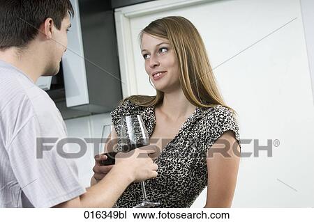 young woman having glass of wine and flirting with man View Large Photo Image Stock Image - young woman having glass of wine and flirting with man. Fotosearch