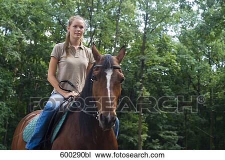 young woman on horse View Large Photo Image Stock Image - young woman on horse. Fotosearch