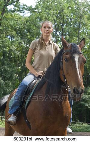 young woman on horse View Large Photo Image Stock Image - young woman on horse. Fotosearch