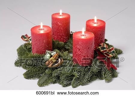 Stock Image - advent wreath with four burning candles. Fotosearch