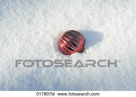 bauble lying in snow View Large Photo Image Stock Image - bauble lying in snow. Fotosearch