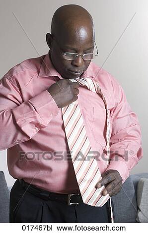 black businessman choosing tie View Large Photo Image Stock Image - black businessman choosing tie. Fotosearch