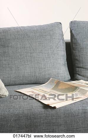 business paper lying on empty sofa View Large Photo Image Stock Image - business paper lying on empty sofa. Fotosearch