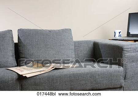 business paper lying on empty sofa View Large Photo Image Stock Image - business paper lying on empty sofa. Fotosearch