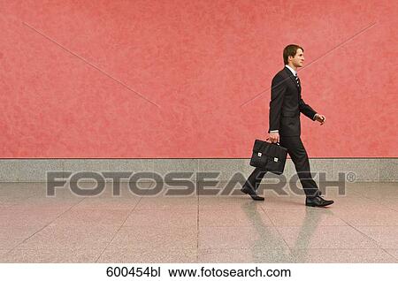 businessman in corridor carrying briefcase View Large Photo Image Stock Image - businessman in corridor carrying briefcase. Fotosearch
