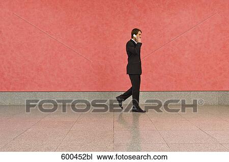 businessman in corridor talking on mobile phone View Large Photo Image Stock Image - businessman in corridor talking on mobile phone. Fotosearch