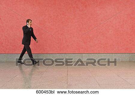 businessman in corridor talking on mobile phone View Large Photo Image Stock Image - businessman in corridor talking on mobile phone. Fotosearch