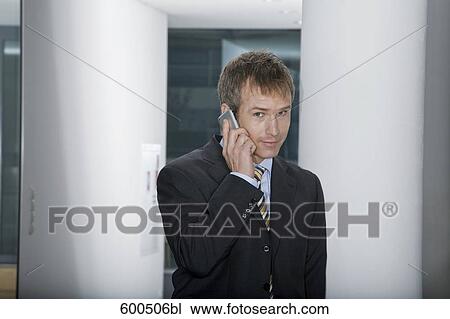businessman talking on mobile phone View Large Photo Image Stock Image - businessman talking on mobile phone. Fotosearch