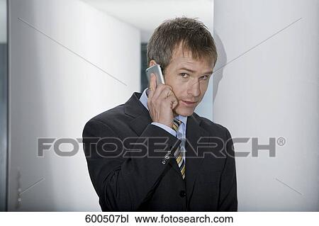 businessman talking on mobile phone View Large Photo Image Stock Image - businessman talking on mobile phone. Fotosearch