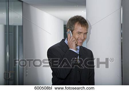 businessman talking on mobile phone View Large Photo Image Stock Image - businessman talking on mobile phone. Fotosearch