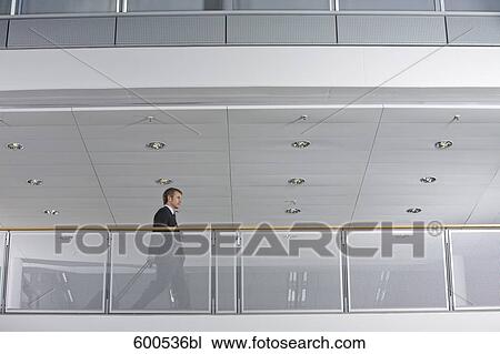 businessman with carry-on in office building View Large Photo Image Stock Image - businessman with carry-on in office building. Fotosearch