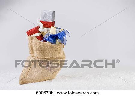 christmas presents pouring out of sack View Large Photo Image Stock Image - christmas presents pouring out of sack. Fotosearch