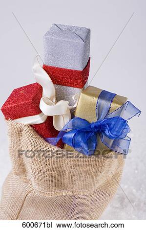 christmas presents pouring out of sack View Large Photo Image Stock Image - christmas presents pouring out of sack. Fotosearch