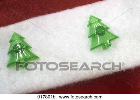 Stock Image - close-up of christmas decoration showing two little christmas trees. Fotosearch