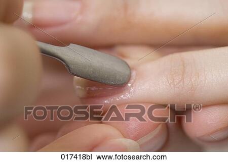 close-up of woman undergoing treatment of her fingernails View Large Photo Image Stock Image - close-up of woman undergoing treatment of her fingernails. Fotosearch