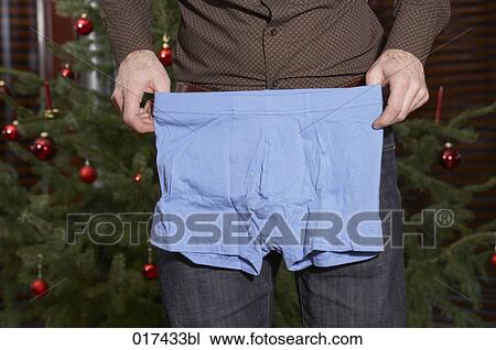 detail of man showing his christmas present blue underpants View Large Photo Image Stock Image - detail of man showing his christmas present blue underpants. Fotosearch