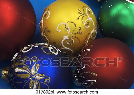 Stock Image - five colourful baubles. Fotosearch