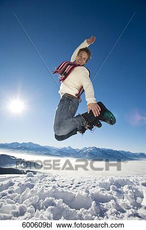 full body portrait of man doing jump on mountain top View Large Photo Image Stock Image - full body portrait of man doing jump on mountain top. Fotosearch