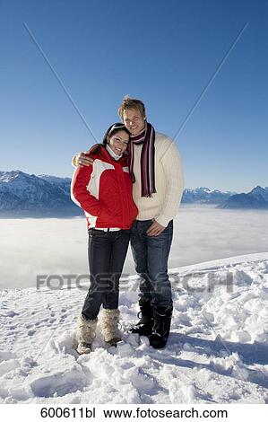full body portrait of young couple standing on mountain top View Large Photo Image Stock Image - full body portrait of young couple standing on mountain top. Fotosearch