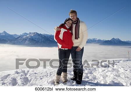 full body portrait of young couple standing on mountain top View Large Photo Image Stock Image - full body portrait of young couple standing on mountain top. Fotosearch