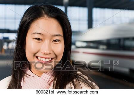 headshot of young japanese woman at train station View Large Photo Image Stock Image - headshot of young japanese woman at train station. Fotosearch