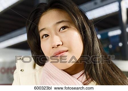 headshot of young japanese woman at train station View Large Photo Image Stock Image - headshot of young japanese woman at train station. Fotosearch