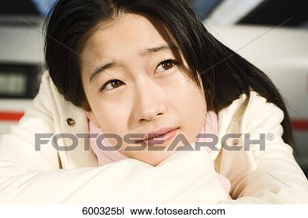 headshot of young japanese woman at train station View Large Photo Image Stock Image - headshot of young japanese woman at train station. Fotosearch