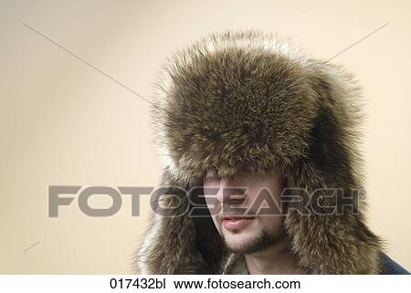 headshot of young man wearing fur hat View Large Photo Image Stock Image - headshot of young man wearing fur hat. Fotosearch