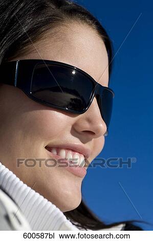 headshot of young woman wearing sunglasses View Large Photo Image Stock Image - headshot of young woman wearing sunglasses. Fotosearch