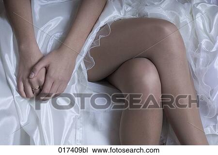 legs of bride in white wedding dress View Large Photo Image Stock Image - legs of bride in white wedding dress. Fotosearch