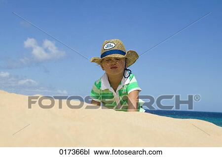 little girl crouching on sandy beach View Large Photo Image Stock Image - little girl crouching on sandy beach. Fotosearch