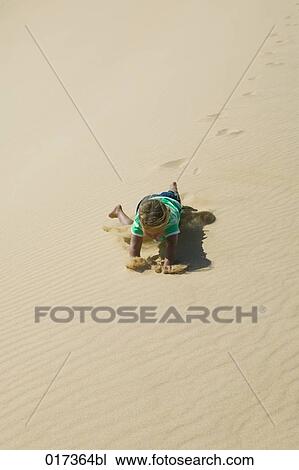 little girl falling on sandy beach View Large Photo Image Stock Image - little girl falling on sandy beach. Fotosearch