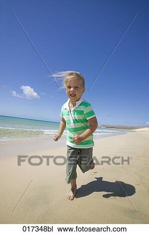 little girl running along sandy beach View Large Photo Image Stock Image - little girl running along sandy beach. Fotosearch