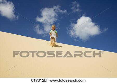 little girl running down sand dune View Large Photo Image Stock Image - little girl running down sand dune. Fotosearch