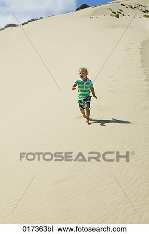 little girl running on sandy beach View Large Photo Image Stock Image - little girl running on sandy beach. Fotosearch