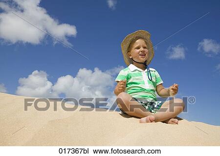 little girl sitting on sandy beach View Large Photo Image Stock Image - little girl sitting on sandy beach. Fotosearch