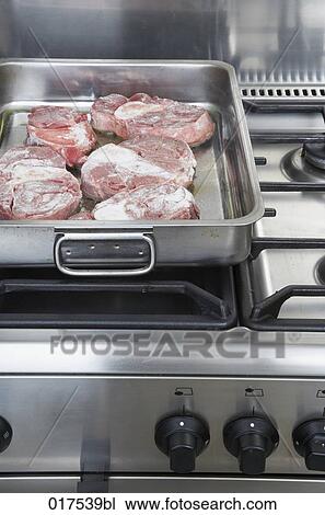pieces of meat in silver pot on stove View Large Photo Image Stock Image - pieces of meat in silver pot on stove. Fotosearch