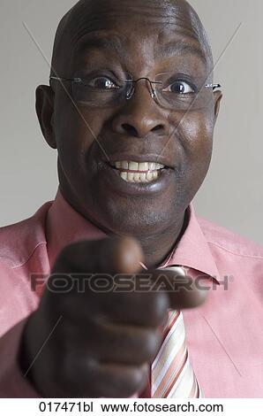 portrait of black businessman pointing towards camera View Large Photo Image Stock Image - portrait of black businessman pointing towards camera. Fotosearch