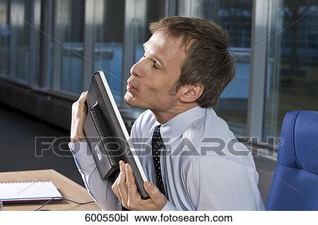 portrait of businessman embracing his computer monitor View Large Photo Image Stock Image - portrait of businessman embracing his computer monitor. Fotosearch