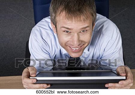 portrait of businessman embracing his computer monitor View Large Photo Image Stock Image - portrait of businessman embracing his computer monitor. Fotosearch
