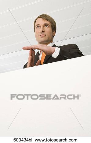 Stock Image - portrait of businessman making break gesture . Fotosearch