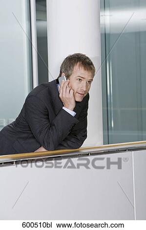 portrait of businessman talking on mobile phone View Large Photo Image Stock Image - portrait of businessman talking on mobile phone. Fotosearch