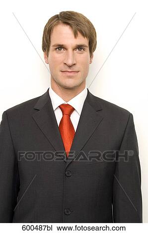 Stock Image - portrait of businessman wearing red tie. Fotosearch