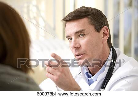 portrait of doctor talking to patient View Large Photo Image Stock Image - portrait of doctor talking to patient. Fotosearch