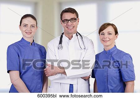 portrait of doctor with two nurses View Large Photo Image Stock Image - portrait of doctor with two nurses. Fotosearch