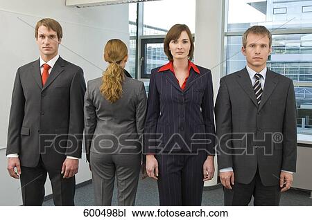 portrait of four business people standing in line one standing with back to camera View Large Photo Image Stock Image - portrait of four business people standing in line one standing with back to camera. Fotosearch