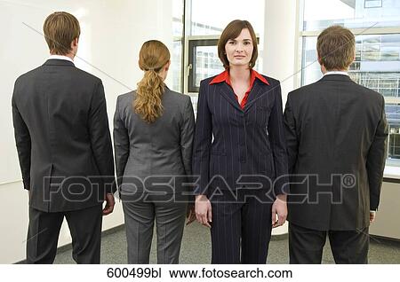 portrait of four business people standing in line one standing with face to camera View Large Photo Image Stock Image - portrait of four business people standing in line one standing with face to camera. Fotosearch