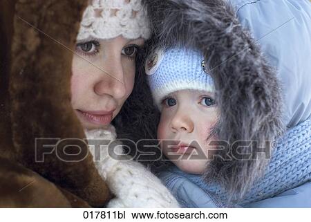 portrait of mother in winter clothes holding baby View Large Photo Image Stock Image - portrait of mother in winter clothes holding baby. Fotosearch