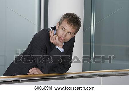 portrait of pensive businessman with mobile phone View Large Photo Image Stock Image - portrait of pensive businessman with mobile phone. Fotosearch