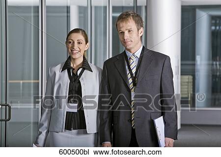 portrait of two executives in corridor of office building View Large Photo Image Stock Image - portrait of two executives in corridor of office building. Fotosearch